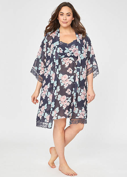 Catherines - alternative to Victoria's Secret for plus size lingerie. A white woman with brown hair stands on a white backdrop. She is wearing a floral babydoll nightgown and kimono robe.
