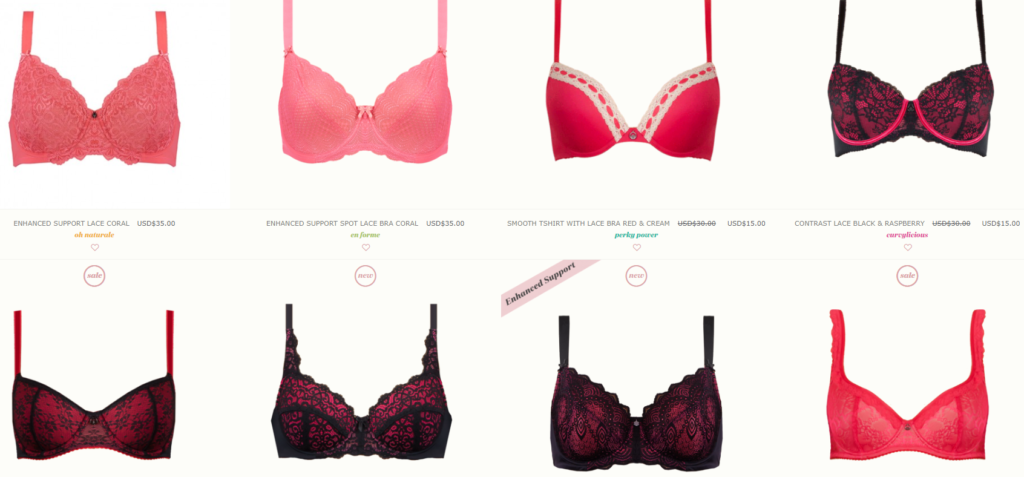 Eight pink and red bras on a white background.