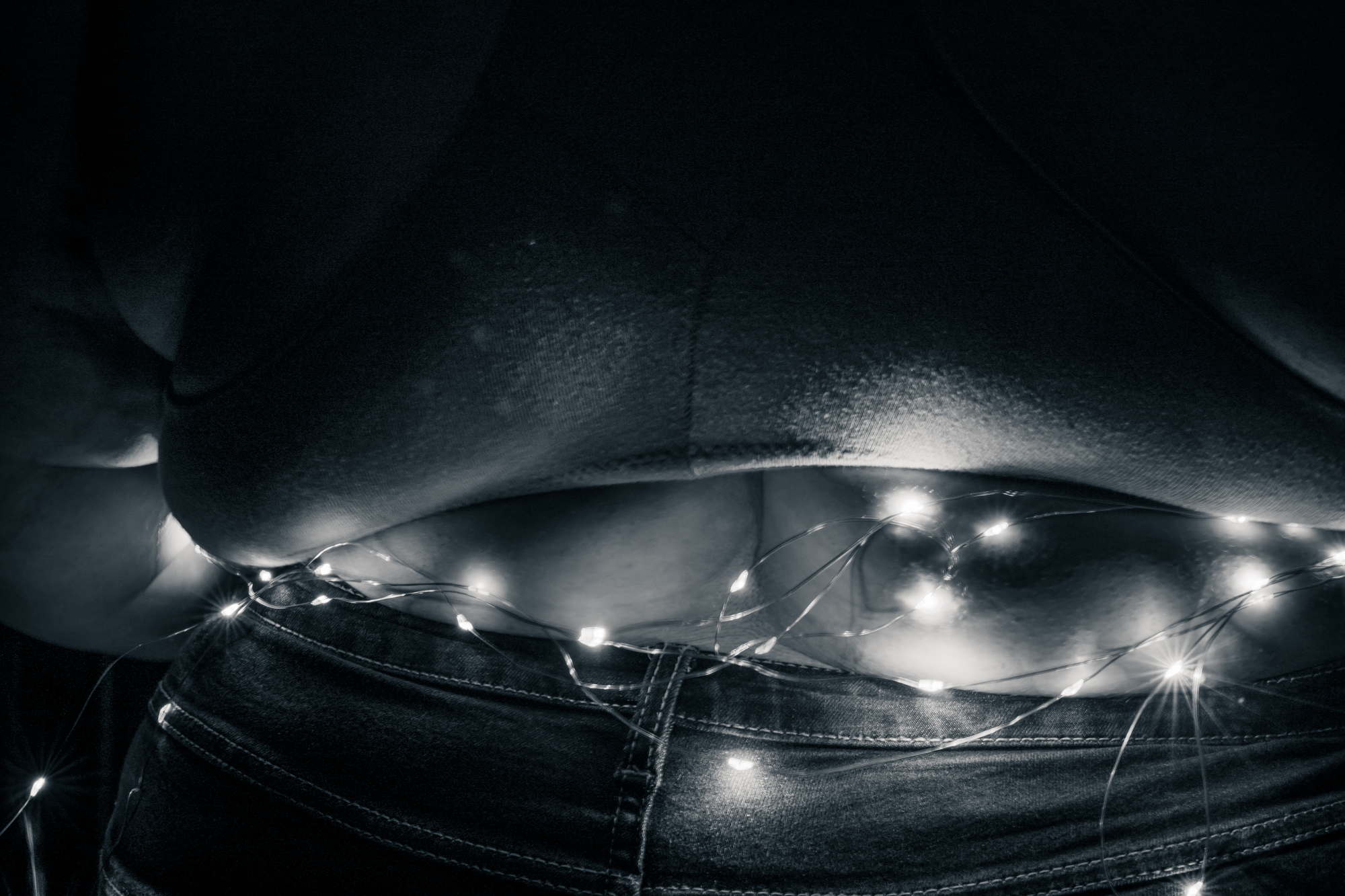A fat person wearing LED lights around their middle during a portrait photo session in Washington