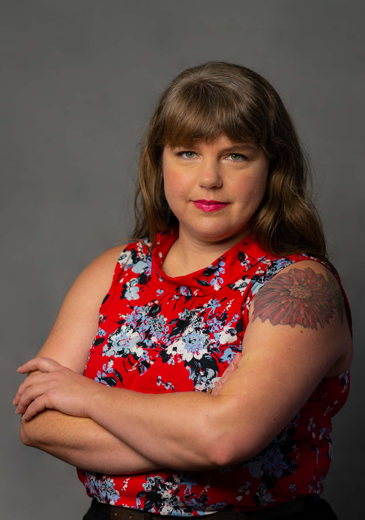  A fat woman looks confidently at the camera during a business headshot session in the PNW