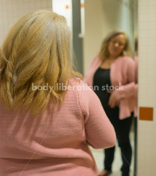 Body Image Stock Photo: Plus Size Woman in Office Bathroom Mirror - Body Liberation Photos