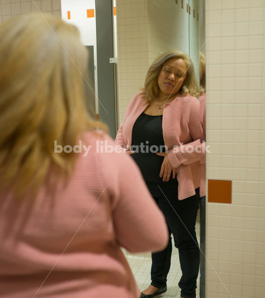 Body Image Stock Photo: Plus Size Woman in Office Bathroom Mirror - Body Liberation Photos