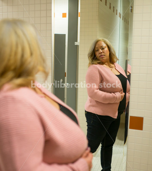 Body Image Stock Photo: Plus Size Woman in Office Bathroom Mirror - Body Liberation Photos