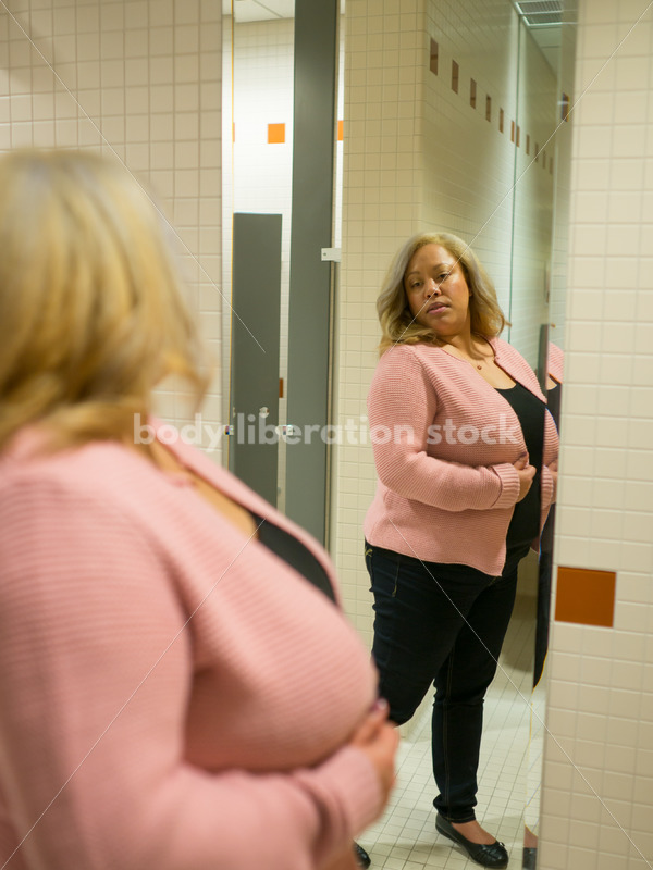 Body Image Stock Photo: Plus Size Woman in Office Bathroom Mirror - Body Liberation Photos