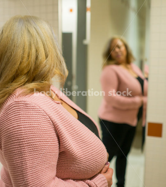 Body Image Stock Photo: Plus Size Woman in Office Bathroom Mirror - Body Liberation Photos