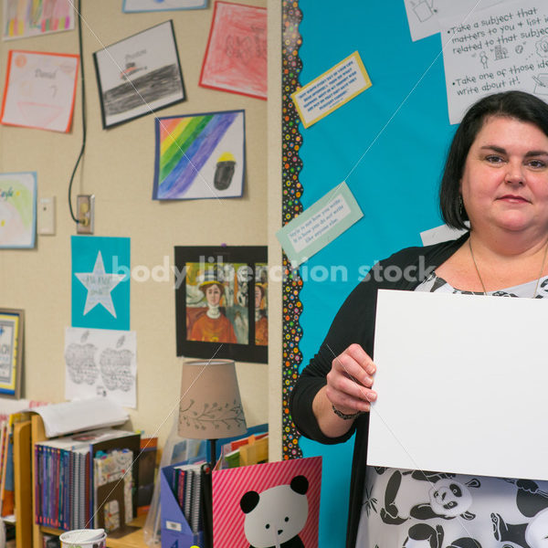 Body Positive Stock Image: Plus Size Teacher with Blank Sign for Your Text - Body Liberation Photos