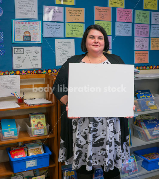 Body Positive Stock Image: Plus Size Teacher with Blank Sign for Your Text - Body Liberation Photos