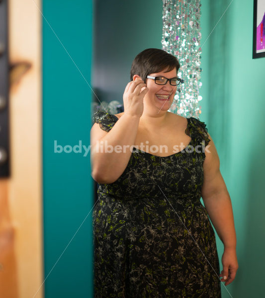 Clothing Retail Stock Photo: Plus Size Woman Tries on Clothes in Dressing Room - Body Liberation Photos