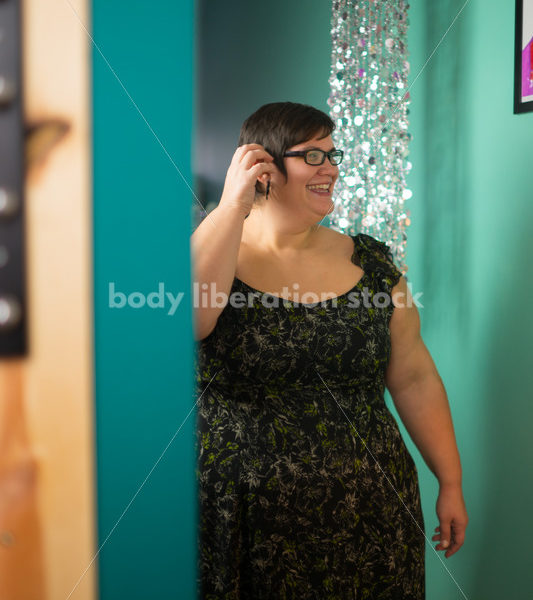 Clothing Retail Stock Photo: Plus Size Woman Tries on Clothes in Dressing Room - Body Liberation Photos