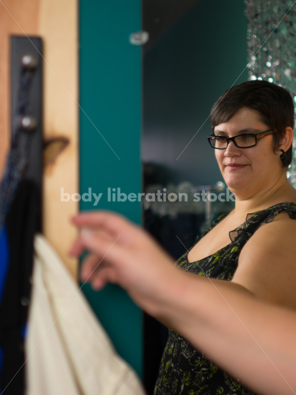 Clothing Retail Stock Photo: Plus Size Woman Tries on Clothes in Dressing Room - Body Liberation Photos