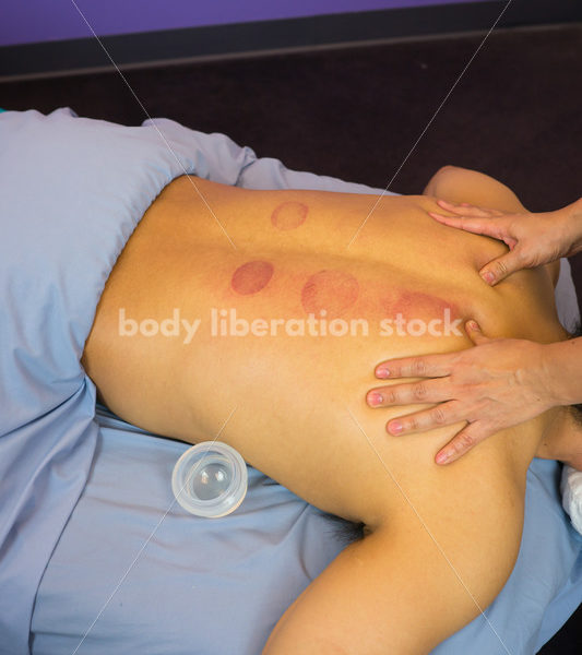 Diverse Massage Therapy Stock Image: Filipino Woman Massages Hispanic Man - Body Liberation Photos