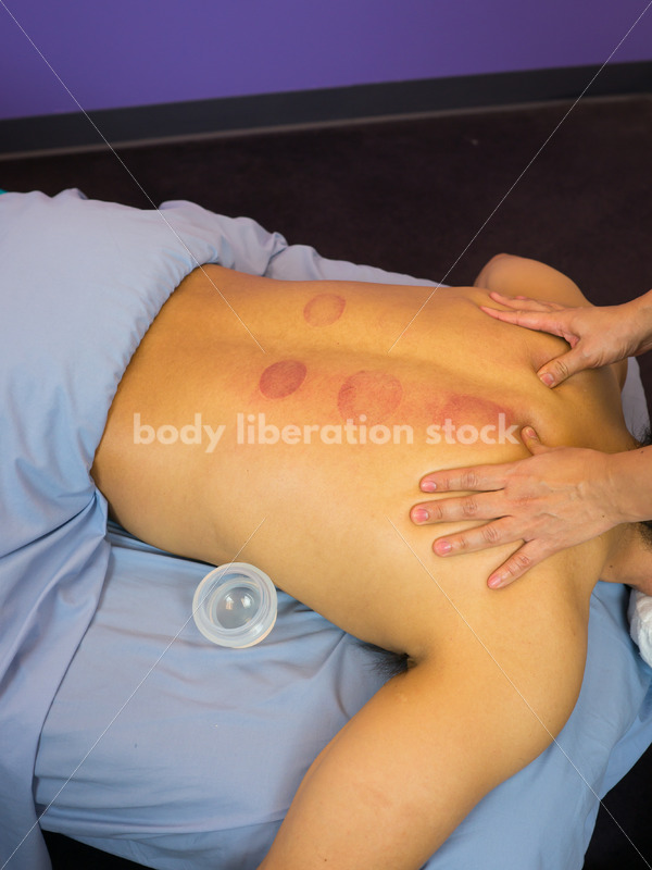 Diverse Massage Therapy Stock Image: Filipino Woman Massages Hispanic Man - Body Liberation Photos