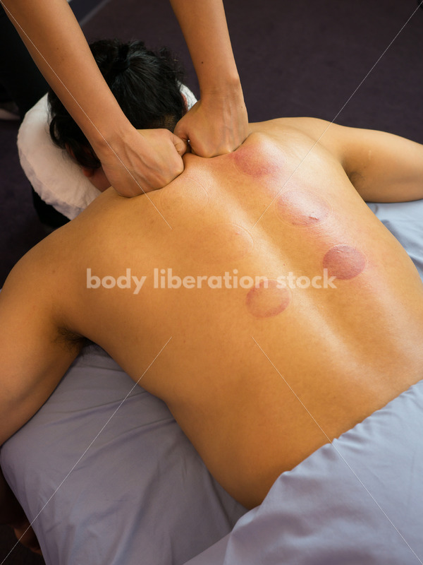 Diverse Massage Therapy Stock Image: Filipino Woman Massages Hispanic Man - Body Liberation Photos