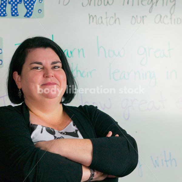 Education Stock Photo: Plus Size Elementary School Teacher with Crossed Arms - Body Liberation Photos