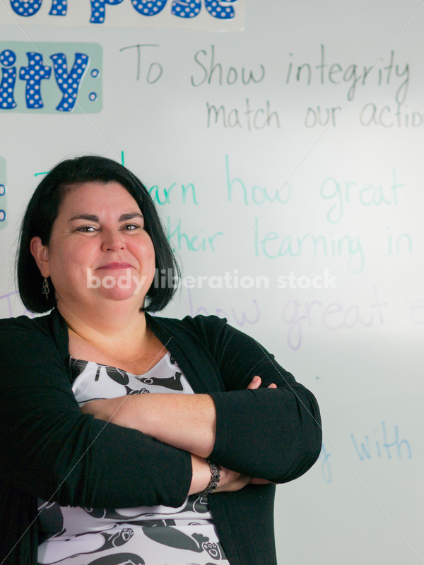 Education Stock Photo: Plus Size Elementary School Teacher with Crossed Arms - Body Liberation Photos