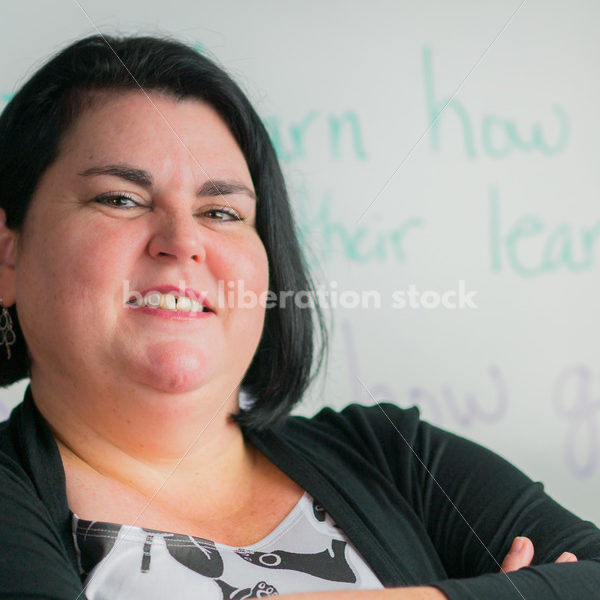 Education Stock Photo: Plus Size Elementary School Teacher with Crossed Arms - Body Liberation Photos