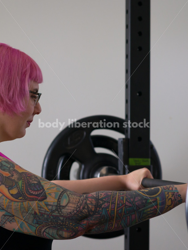 HAES Stock Photo: Female Weightlifter with Pink Hair Does Wide Stance Squat - Body Liberation Photos