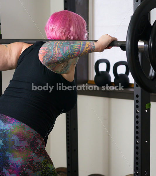 HAES Stock Photo: Female Weightlifter with Pink Hair Does Wide Stance Squat - Body Liberation Photos