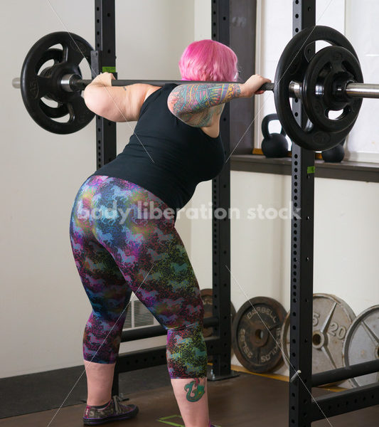 HAES Stock Photo: Female Weightlifter with Pink Hair Does Wide Stance Squat - Body Liberation Photos