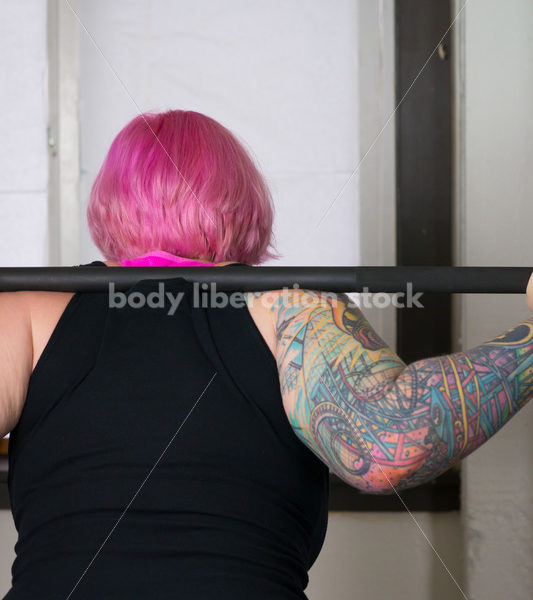 HAES Stock Photo: Female Weightlifter with Pink Hair Does Wide Stance Squat - Body Liberation Photos