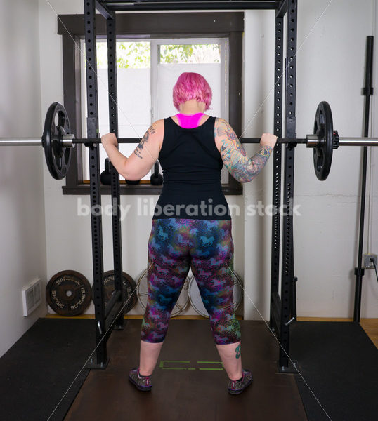 HAES Stock Photo: Female Weightlifter with Pink Hair Does Wide Stance Squat - Body Liberation Photos