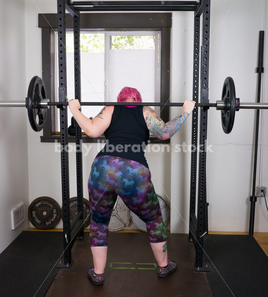 HAES Stock Photo: Female Weightlifter with Pink Hair Does Wide Stance Squat - Body Liberation Photos