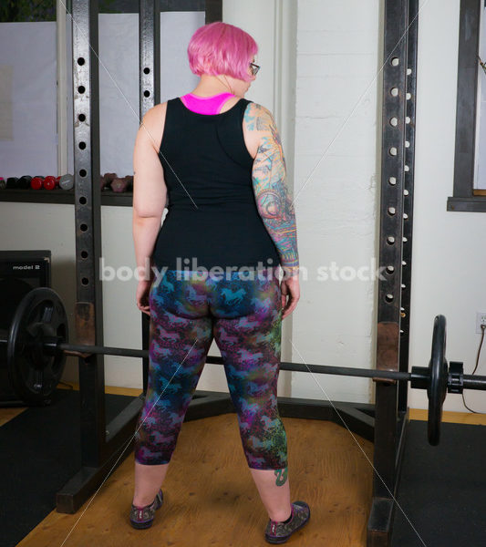 HAES Stock Photo: Female Weightlifter with Pink Hair Lifts Heavy Weight in Gym - Body Liberation Photos