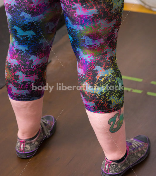 HAES Stock Photo: Female Weightlifter with Pink Hair Standing in Weight Lifting Gym - Body Liberation Photos