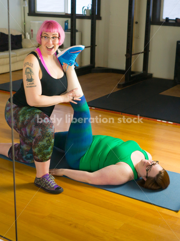 HAES Stock Photo: Personal Trainer Helps Client in Stretching Exercise - Body Liberation Photos