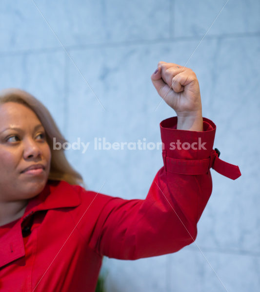 Human Rights & LGBT Stock Photo: African American Lesbian Woman Raising Fist for Protest - Body Liberation Photos