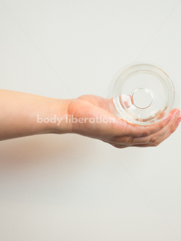 Immigration and Small Business Stock Image: Filipino Woman Holds Glass Massage Cup - Body Liberation Photos