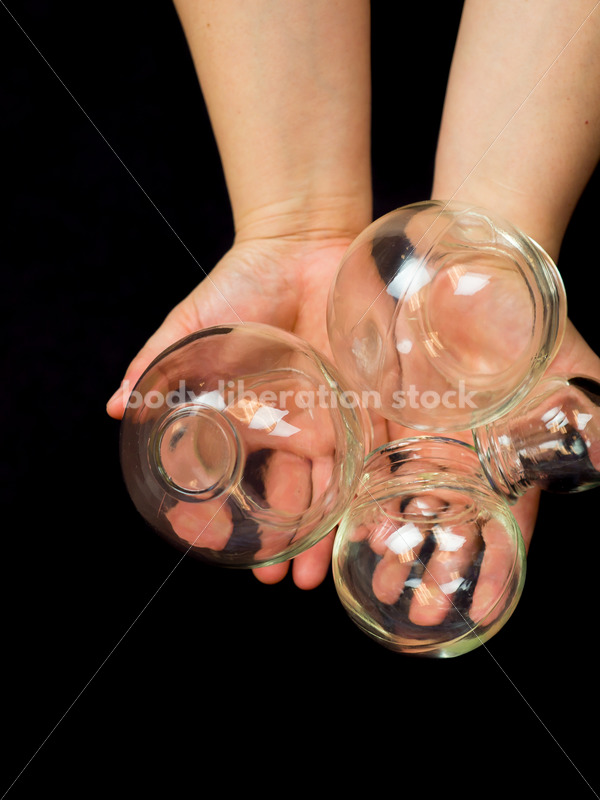 Immigration and Small Business Stock Image: Filipino Woman Holds Glass Massage Cups - Body Liberation Photos
