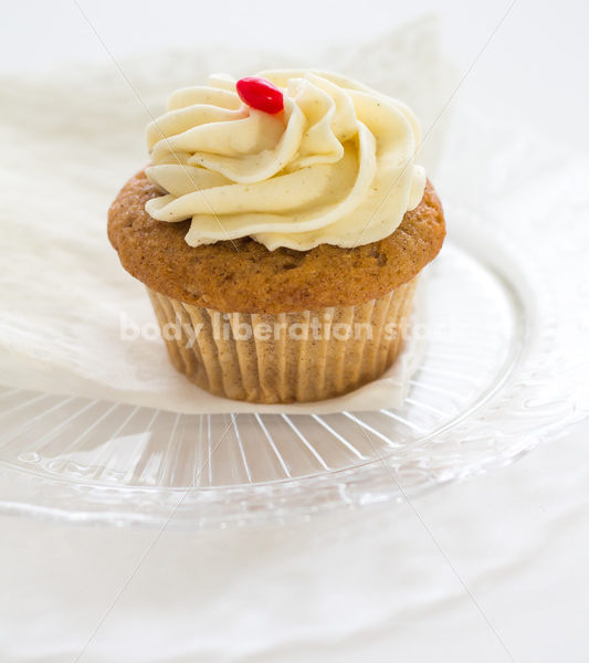 Intuitive Eating Stock Photo: Cupcake on Glass Serving Plate - Body Liberation Photos