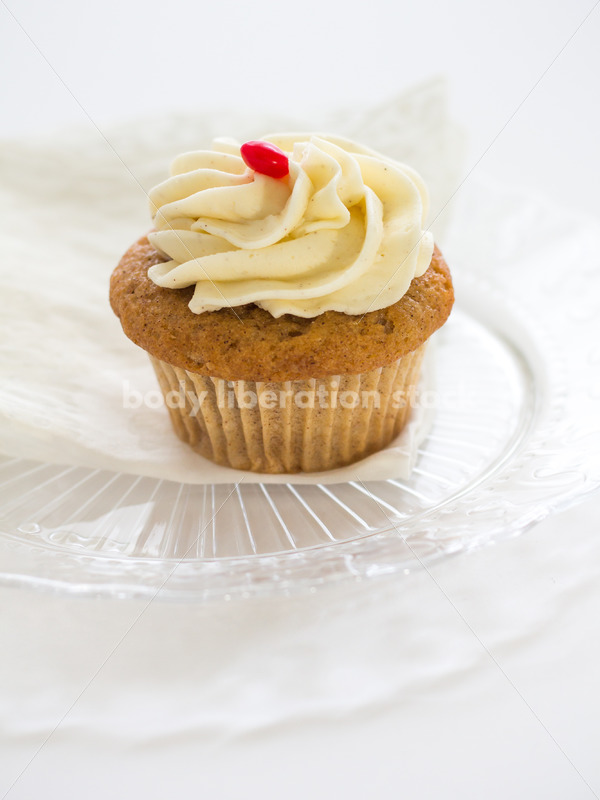 Intuitive Eating Stock Photo: Cupcake on Glass Serving Plate - Body Liberation Photos
