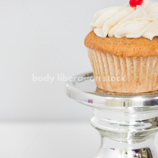 Intuitive Eating Stock Photo: Cupcake on Silver Pedestal - Body Liberation Photos