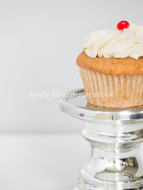 Intuitive Eating Stock Photo: Cupcake on Silver Pedestal - Body Liberation Photos