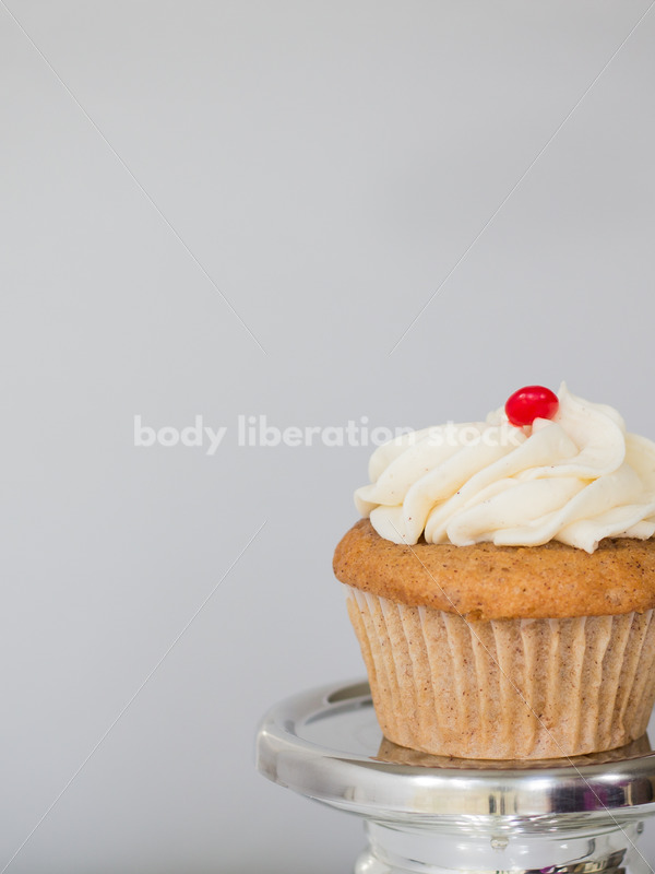 Intuitive Eating Stock Photo: Cupcake on Silver Pedestal - Body Liberation Photos