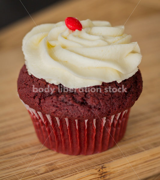 Intuitive Eating Stock Photo: Cupcake on Wooden Cutting Board - Body Liberation Photos