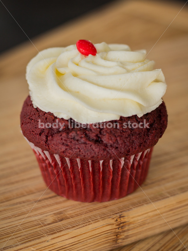 Intuitive Eating Stock Photo: Cupcake on Wooden Cutting Board - Body Liberation Photos