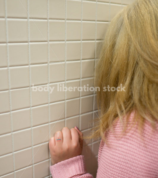 Mental Health and Illness Stock Image: Depressed Plus Size Woman in Office Building Bathroom - Body Liberation Photos