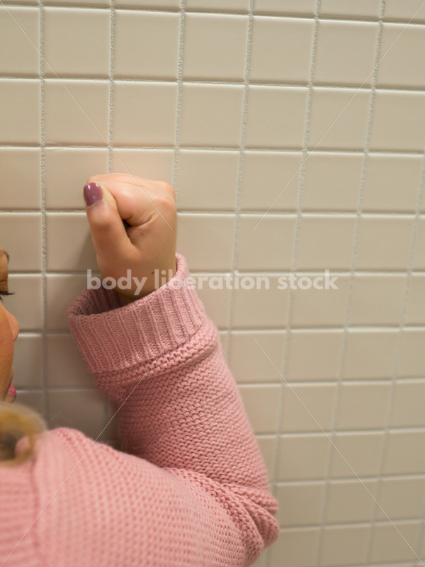 Mental Health and Illness Stock Image: Depressed Plus Size Woman in Office Building Bathroom - Body Liberation Photos