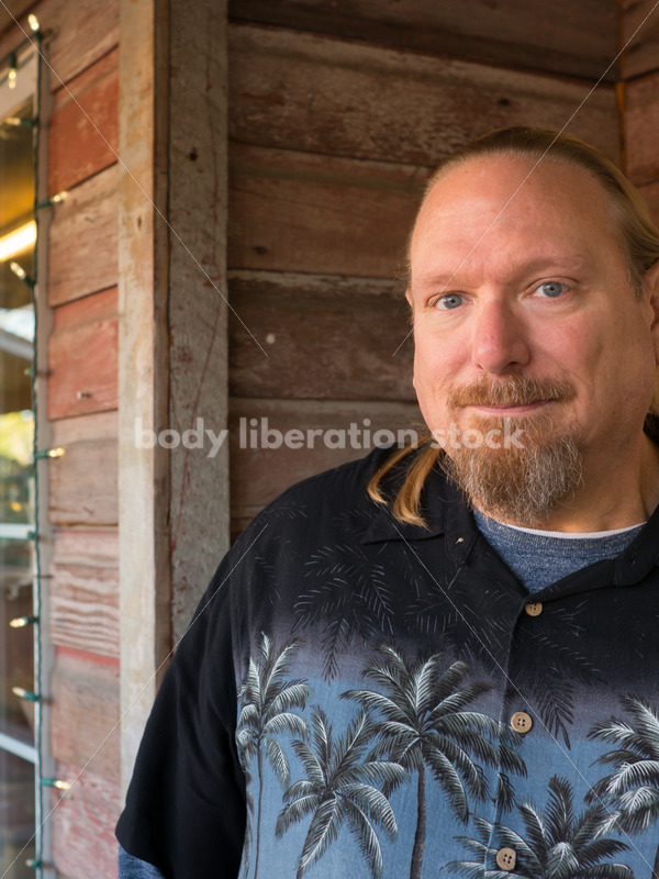 Plus Size Stock Photo: Man in 50s with Rustic Wood Walls - Body Liberation Photos