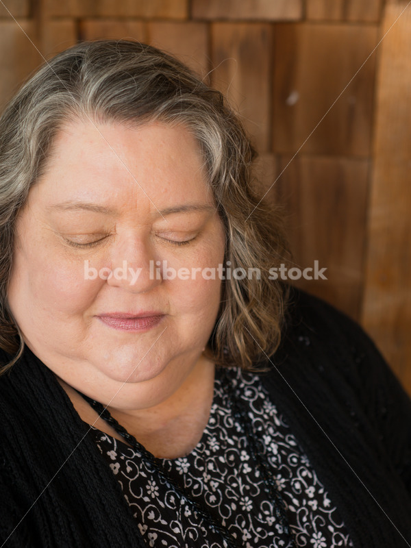 Plus Size Stock Photo: Woman in 50s with Rustic Wood Walls - Body Liberation Photos