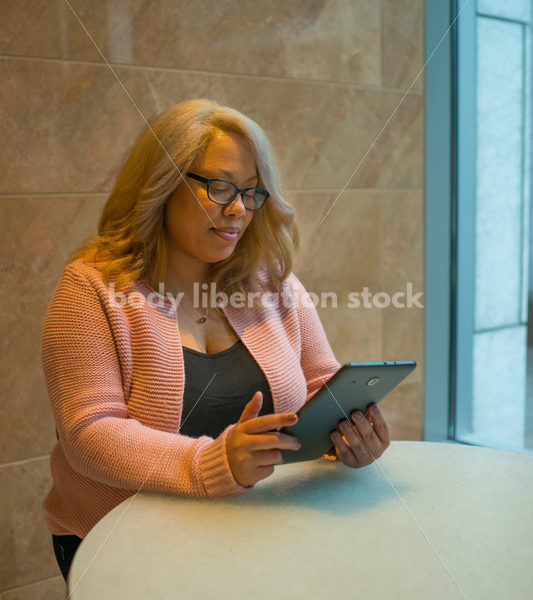 Royalty-Free Business Image: Black LGBT Woman Using Tablet Computer - Body Liberation Photos