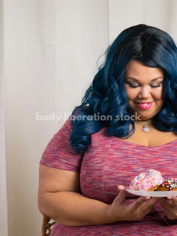 Royalty Free Stock Photo: African American Woman with Glazed Donuts - Body Liberation Photos