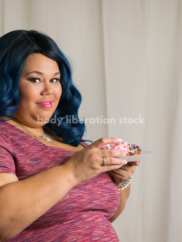 Royalty Free Stock Photo: African American Woman with Glazed Donuts - Body Liberation Photos