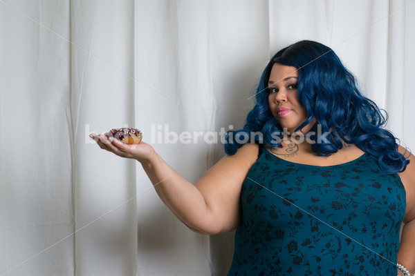 Royalty Free Stock Photo: Black Woman Holds Chocolate Glazed Donut - Body Liberation Photos