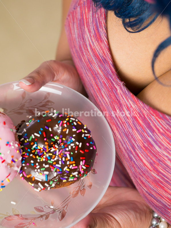 Royalty Free Stock Photo: Black Woman with Glazed Donuts - Body Liberation Photos