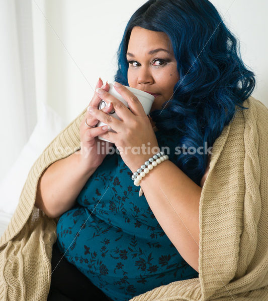 Royalty Free Stock Photo: Plus Size African American Woman Drinks Coffee on Bed - Body Liberation Photos