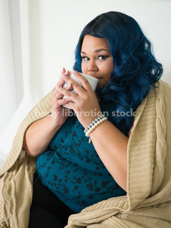 Royalty Free Stock Photo: Plus Size African American Woman Drinks Coffee on Bed - Body Liberation Photos
